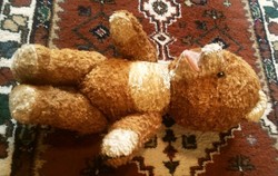 Open-mouthed straw-stuffed teddy bear, a valuable antique rarity from our grandmothers' toys