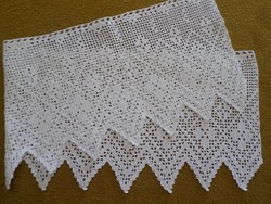 White crochet shelf lace or stained glass curtain.