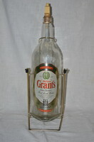 Grant's scotch whiskey bottle with holder