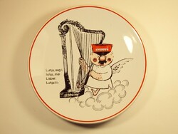 Old ceramic wall plate with a funny German picture of Hitler