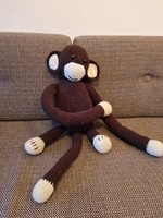 Brown knitted lemur baby