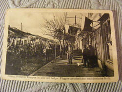 World War I postcard - entry of German troops into a Macedonian town decorated with Bulgarian flags