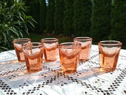 8 thick, salmon-colored cups polished to Art Deco sheet.