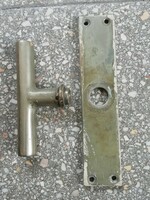 Old copper window handle with cylinder