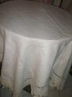 Dreamy antique off-white elegant woven tablecloth with crocheted edges