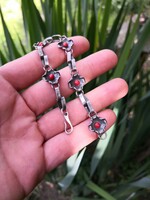 A special silver bracelet with coral stones