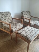An armchair made in retro style with a pair of footrests