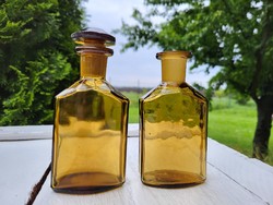 Amber medicine bottles in a pair
