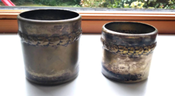 Two copper-plated, metal holders in pairs