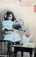 Antique photo postcard little girl watering flowers