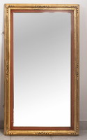 Gold-plated mirror with a frame painted red on the inner edges