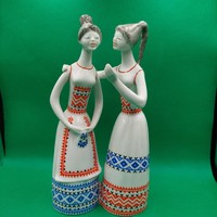 Figurine of J. Starling in a raven house gossiping girls