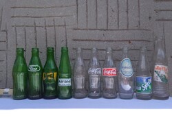 Ten different retro soda bottles together - with labels, other
