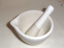 White porcelain mortar and pestle and mortar