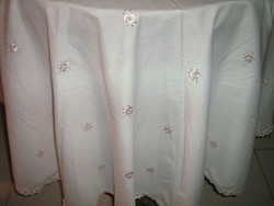 Beautiful and elegant round madeira tablecloth with pink flowers and white lacy edges