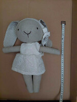 New, handmade rabbit doll made of natural materials, in white clothes