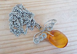 Old silver necklace with amber stone pendant