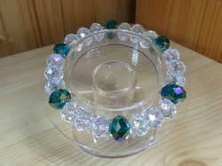 Bracelet made of emerald green and translucent polished crystal beads.