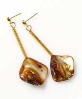 Beautiful earrings with a golden pearl shell and glass beads in the shape of a cylinder