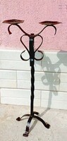 Pair of candle holders on wrought iron legs.