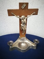 Candlestick with crucifix and holy water holder made of metal. Home altar, blessed Jesus Christ, corpus,