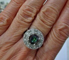 Beautiful silver ring with peridot green and white zircons