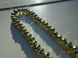 Double row necklaces made of silver faceted pearls