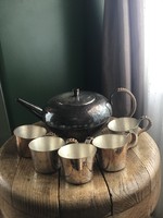 Old silver-plated teapot with glasses