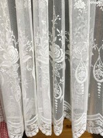 Lace curtain of tulle type, translucent