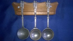 Wall-mounted, pewter decorative spoon set