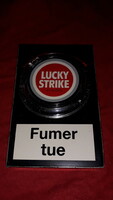 Old metal plate lucky strike cigarette box that can be opened with a rotary button according to the pictures