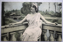 Antique colored photo postcard of a beautiful lady in ancient dress