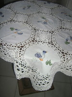 Beautiful machine-embroidered duck tablecloth with a hand-crocheted edge and crocheted insert