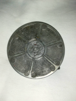 A particularly beautiful, old, decorative metal alloy coaster