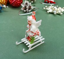 Old retro miniature plastic Christmas tree decoration angel on sleigh with pine tree and star