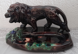 Old ceramic ashtray with a lion