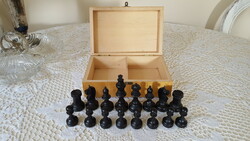 Beautifully crafted wooden chess pieces in a box