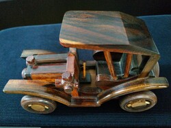Carved, stained wooden car