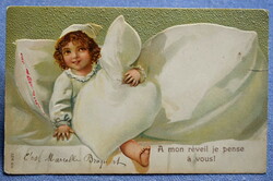 Antique embossed humorous litho postcard of a child in a nightgown quilt