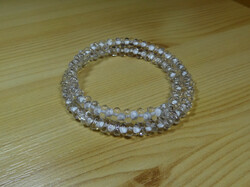 White center crystal farfalle pearl bracelet on memory steel suitable for all wrist sizes.