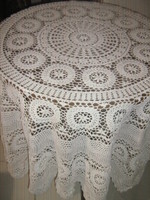 Beautiful hand-crocheted floral round tablecloth with white Art Nouveau features