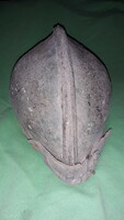 Miner's protective helmet cap made of leather as an antique museum object, according to the pictures