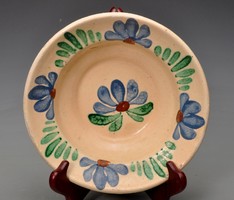 Antique Transylvanian (Szilágyság) glazed floral wall plate, earthenware with hanging lugs, 1910s