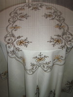 Beautiful cream colored machine flower embroidered tablecloth with wavy edges