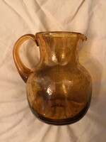 Vintage glass jug with amber bubbles