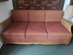 Upholstered sofa with wooden structure, padded side and back walls (with bed linen holder)