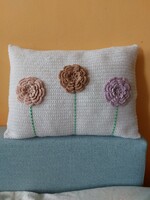 Unique white hand crocheted decorative pillow with 3D flowers.