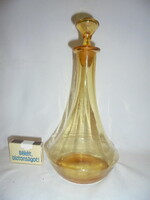 Old, amber-colored liquor bottle, decanter