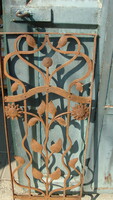 Wrought iron art nouveau entrance door grille.
