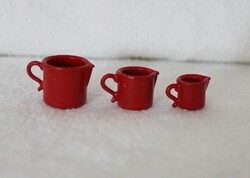 3 red miniature spouts